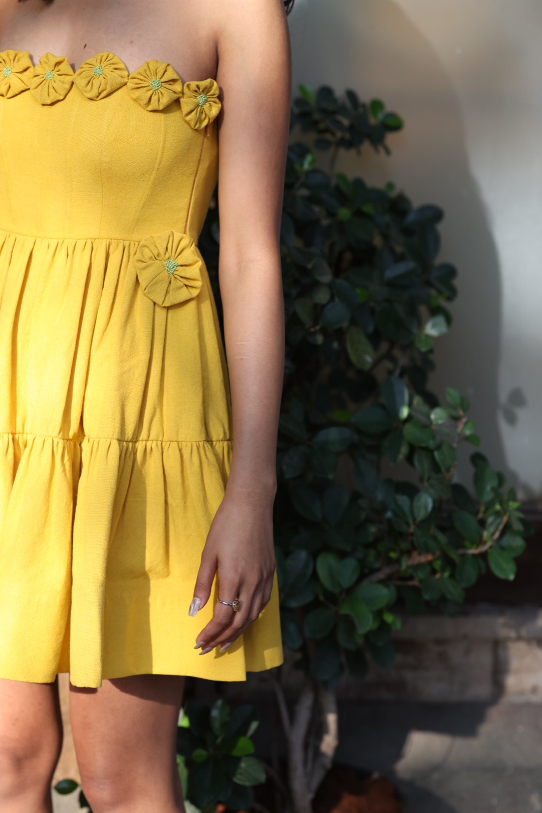 Berry Butter — close on the rosette-trimmed bodice and tiered skirt