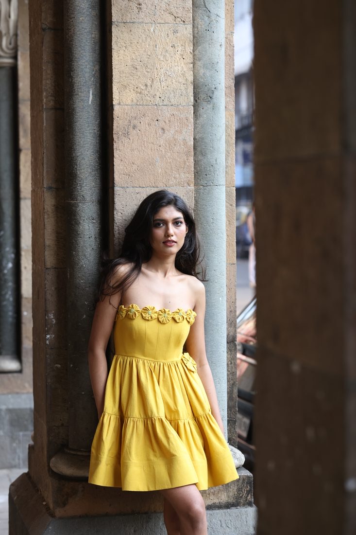 Berry Butter — leaning against a stone column on the street