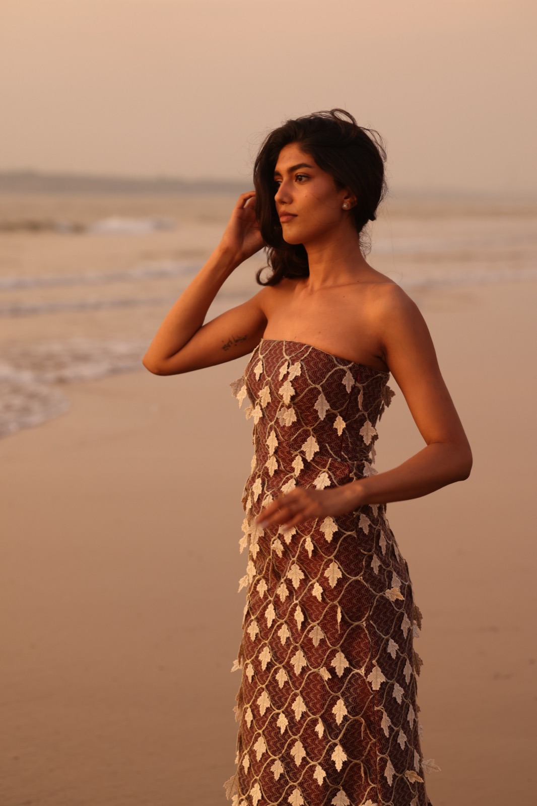 Brown Tupelo — printed silk maxi on the beach at dusk