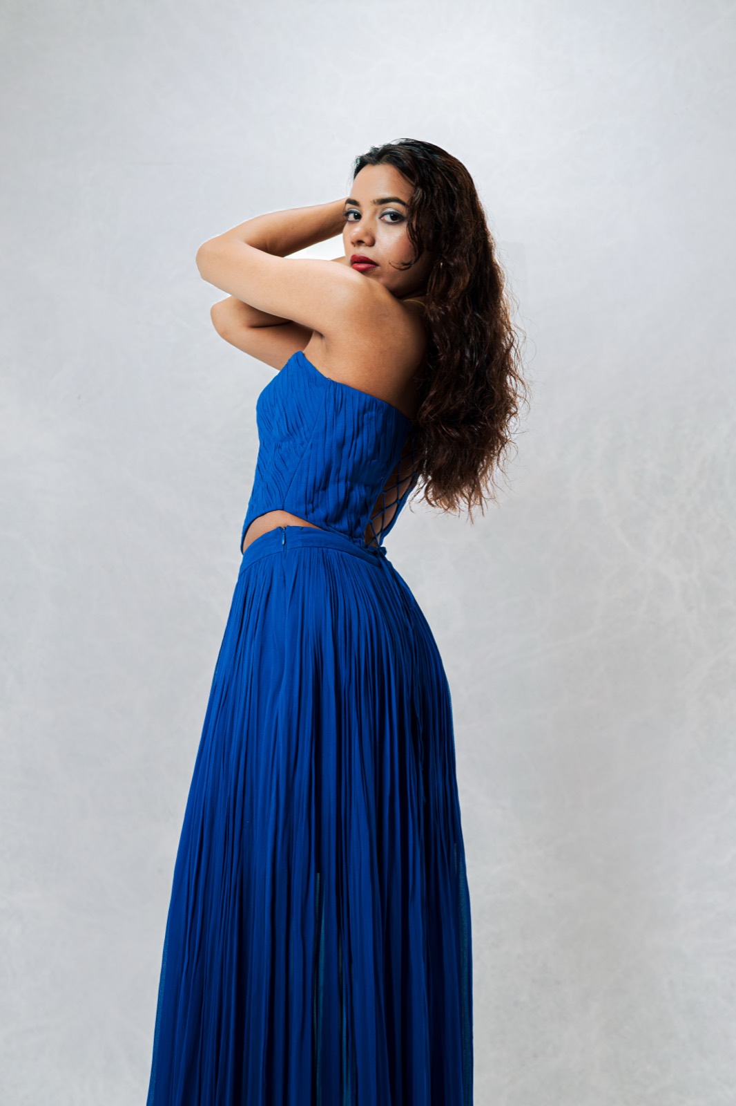 Cobalt Pleated Set — full length, a strapless cobalt corset over a pleated floor-length skirt