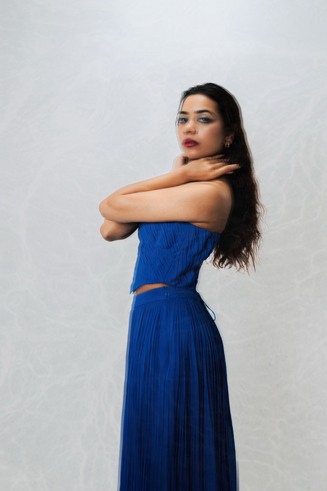 Cobalt Pleated Set — closer on the ruched corset bodice and the open waist