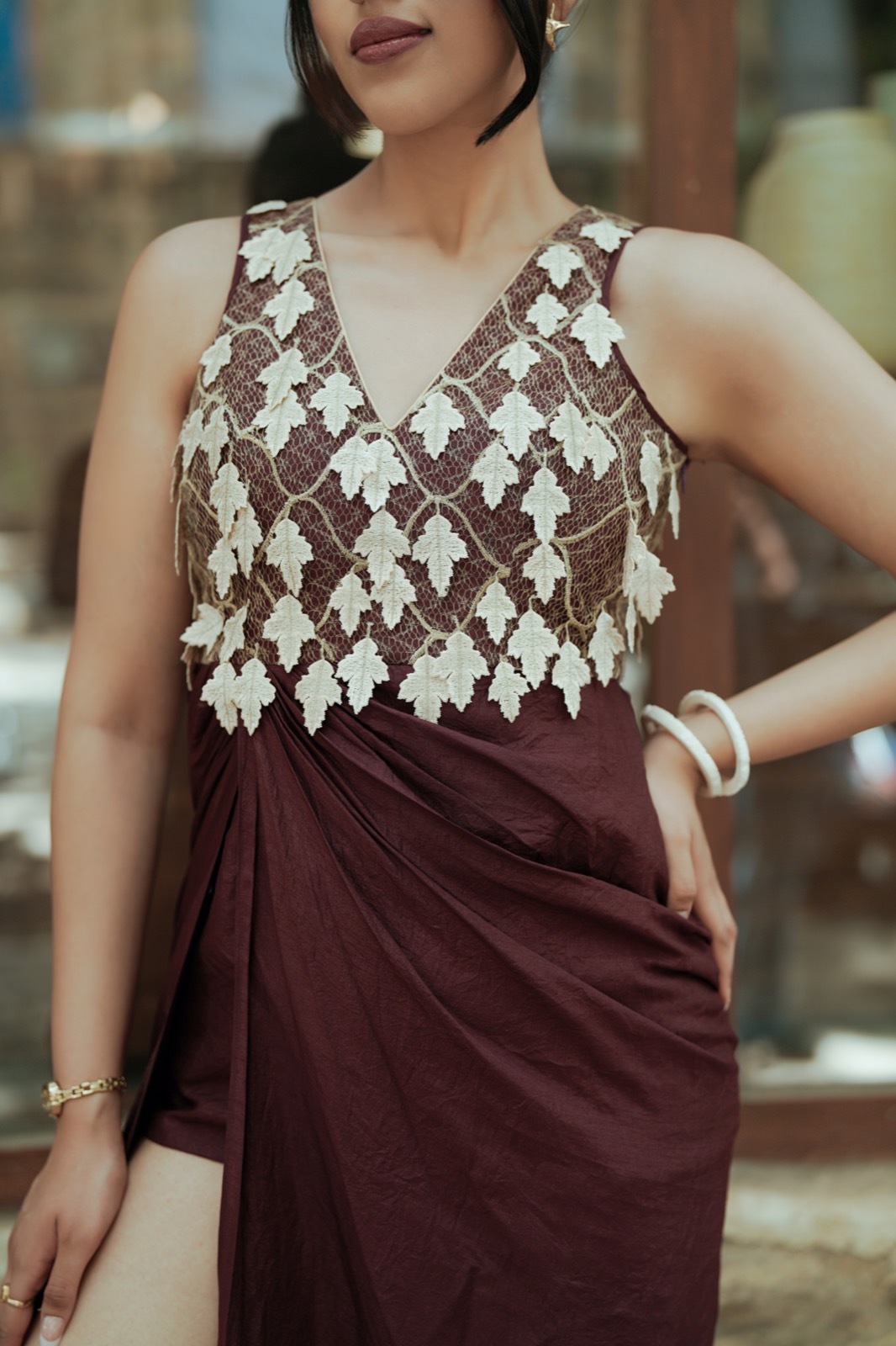 Ivory Drop — the bodice, ivory leaves worked over sheer net and hanging free at the hem