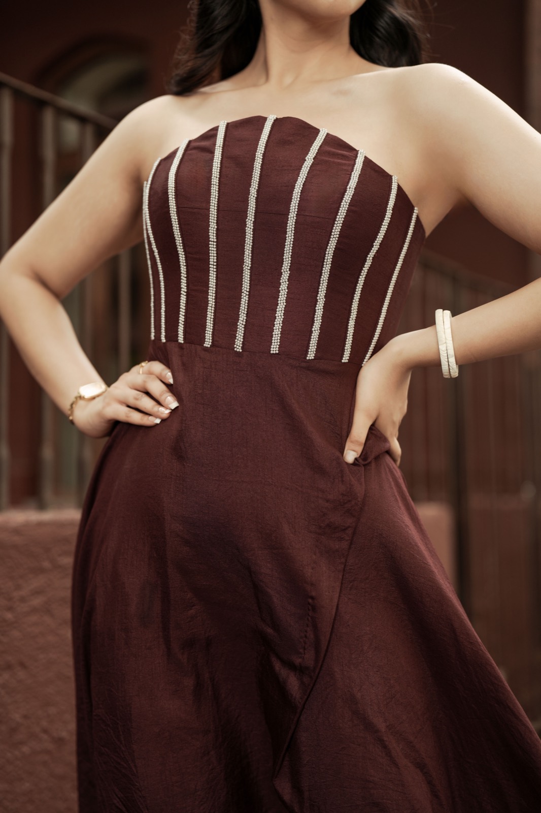 Pearl Syrup — the pearled bodice and the curved overlap where the skirt crosses itself