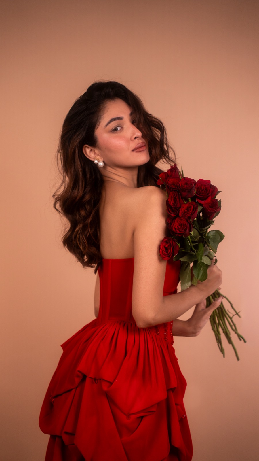 Ruby Bubble — held with a bunch of red roses