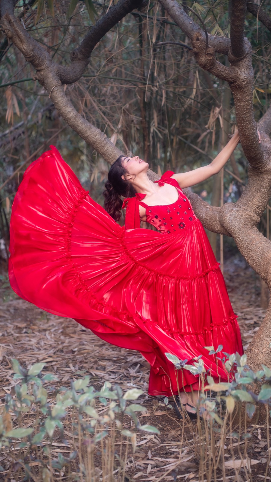 Peony Tiers — the skirt caught mid-movement beside a tree