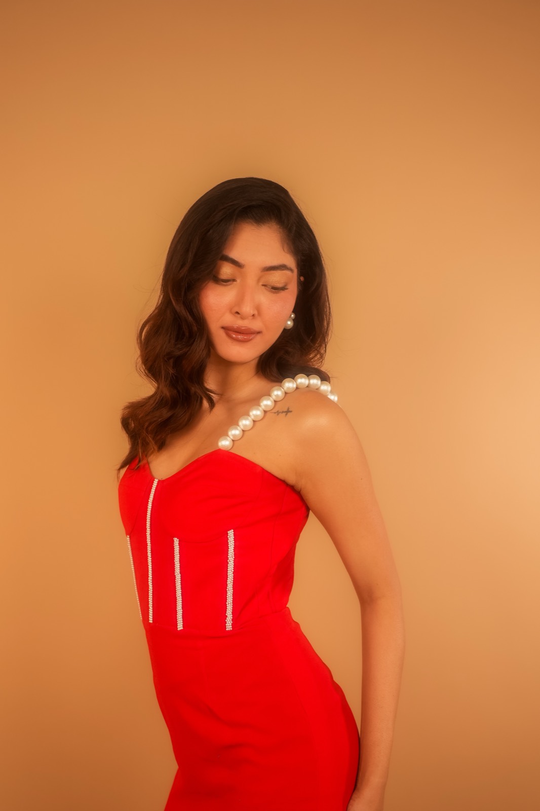 Scarlet — The corset bodice and its crystal-trimmed seams