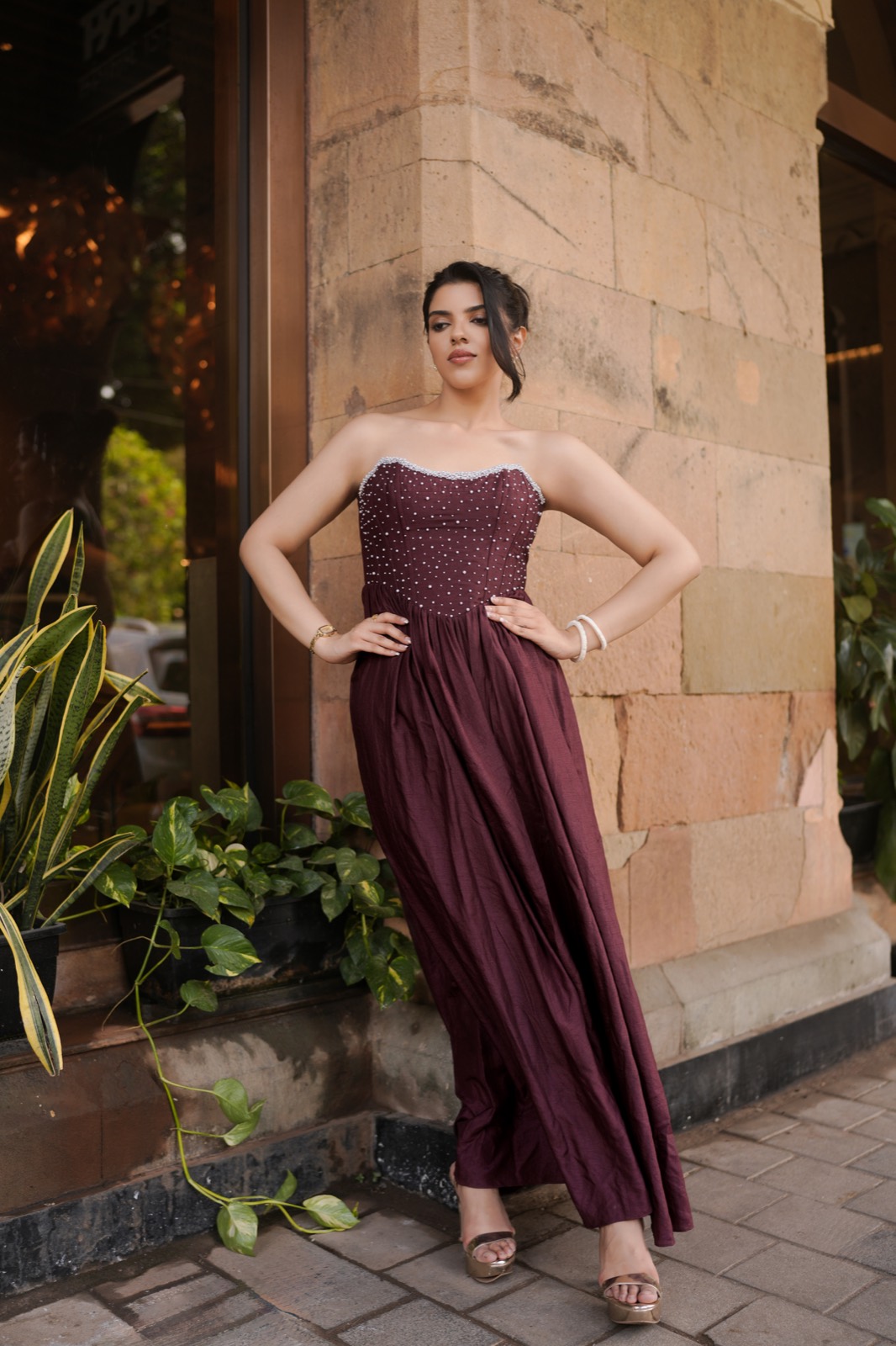 Pearl Galaxy — standing beside a column, the full skirt falling to the floor